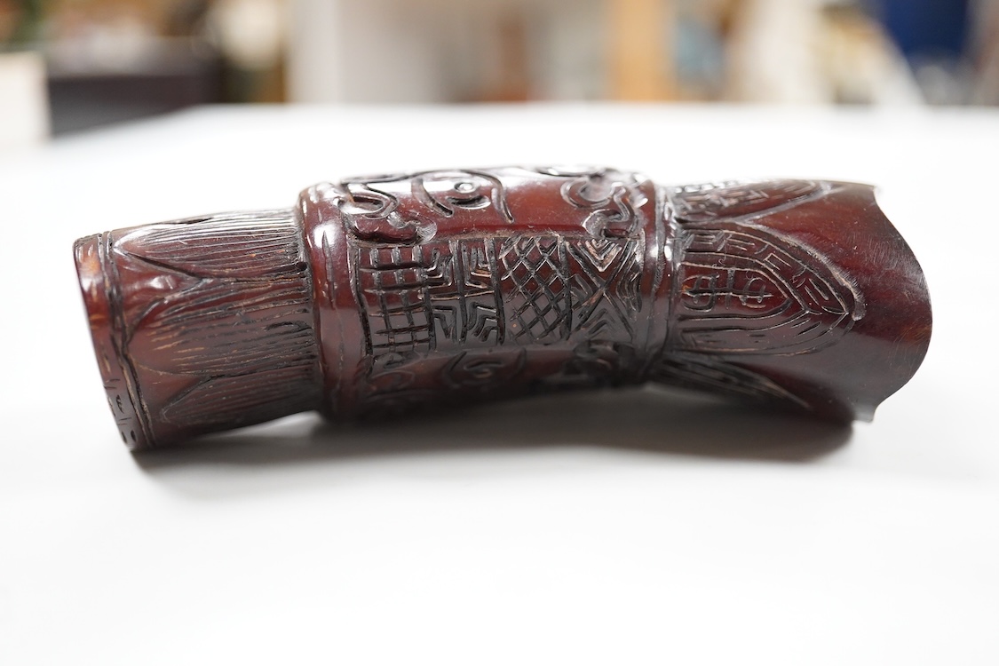 A Chinese carved horn jug, 11cm high